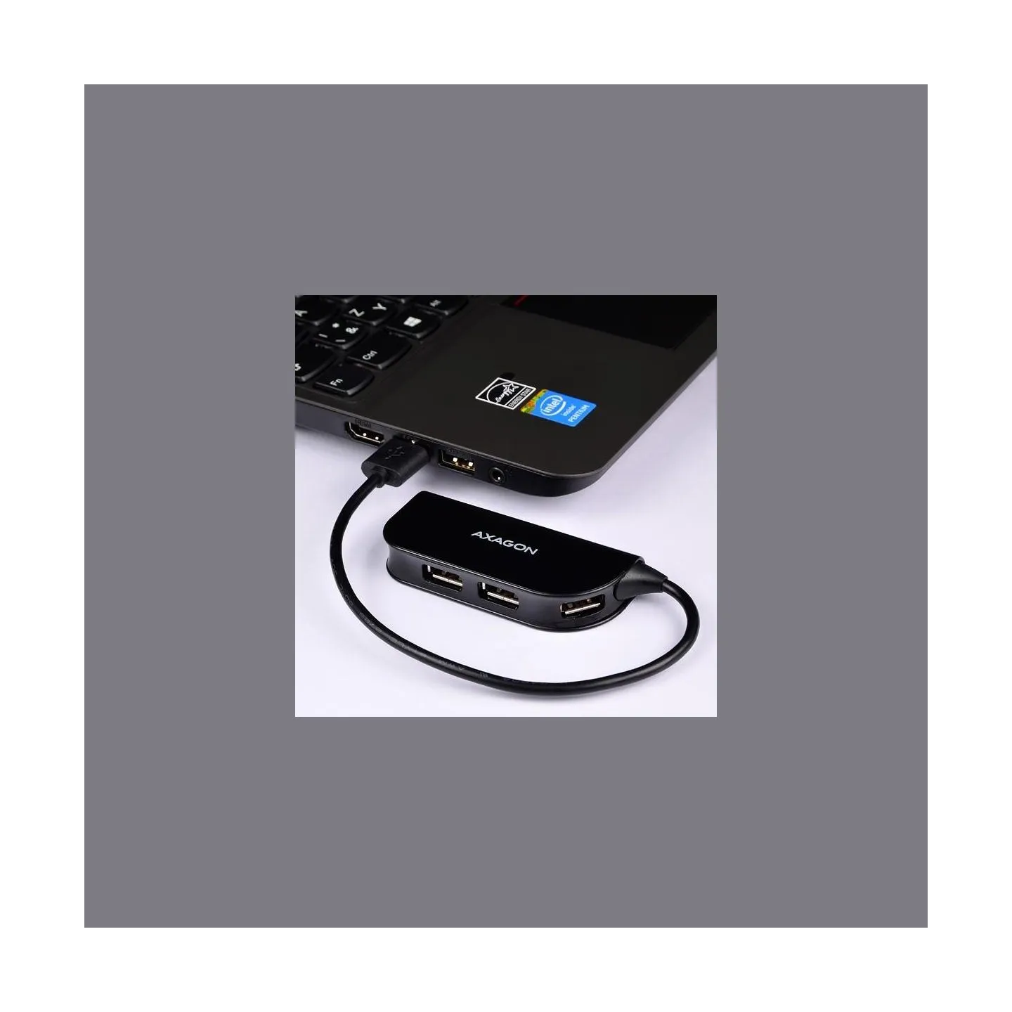 Axagon Handy four-port USB 2.0 hub with a permanently connected USB cable. Black.